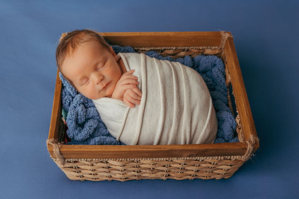 Baby sleeping during their newborn photos.