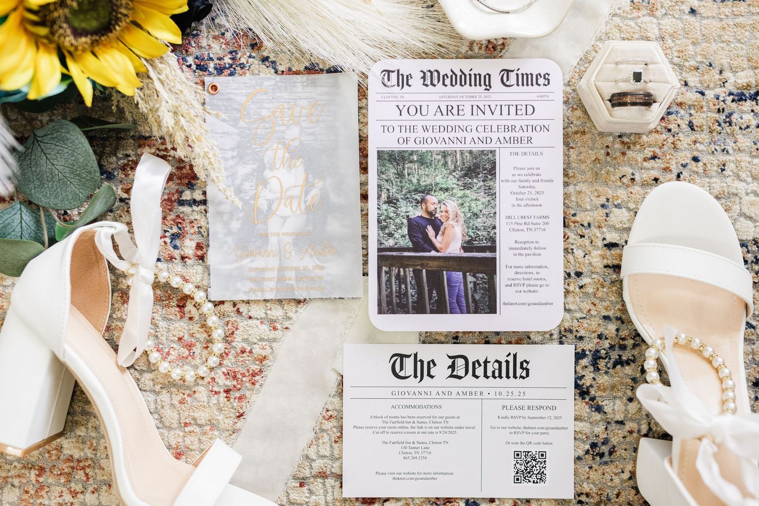 Wedding invitation suite styled with white heeled sandals, sunflowers, and newspaper-themed stationery on a patterned rug.