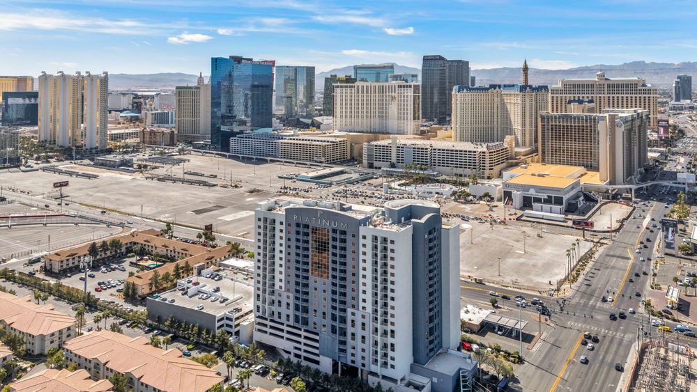 Aerial view of The Platinum Hotel near the Las Vegas Strip with resort skyline and clear blue sky.