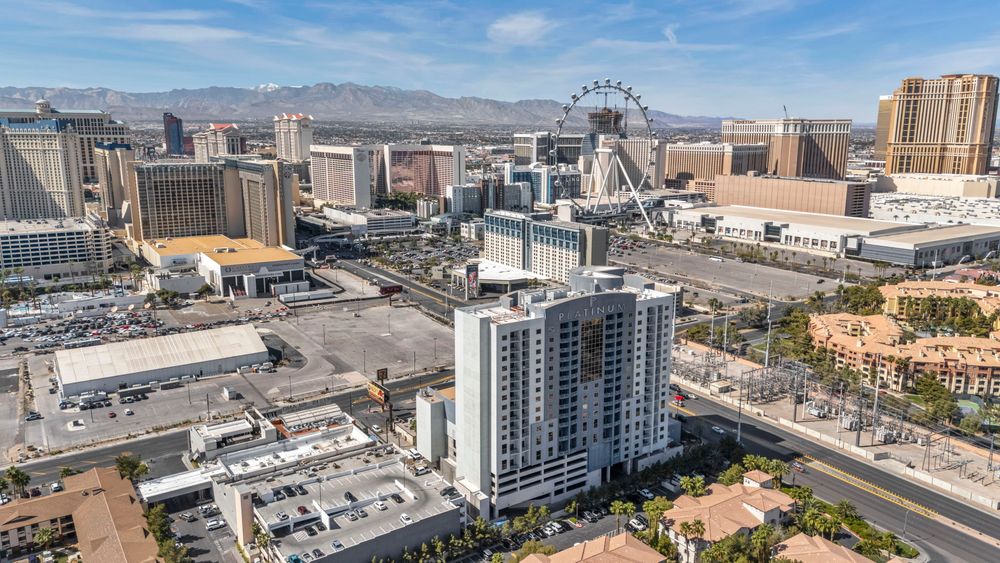 Aerial view of The Platinum Hotel with the High Roller Ferris wheel and Las Vegas Strip in background.