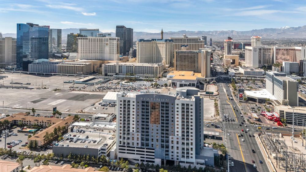 Daytime aerial view of The Platinum Hotel surrounded by the iconic Las Vegas Strip resort skyline.