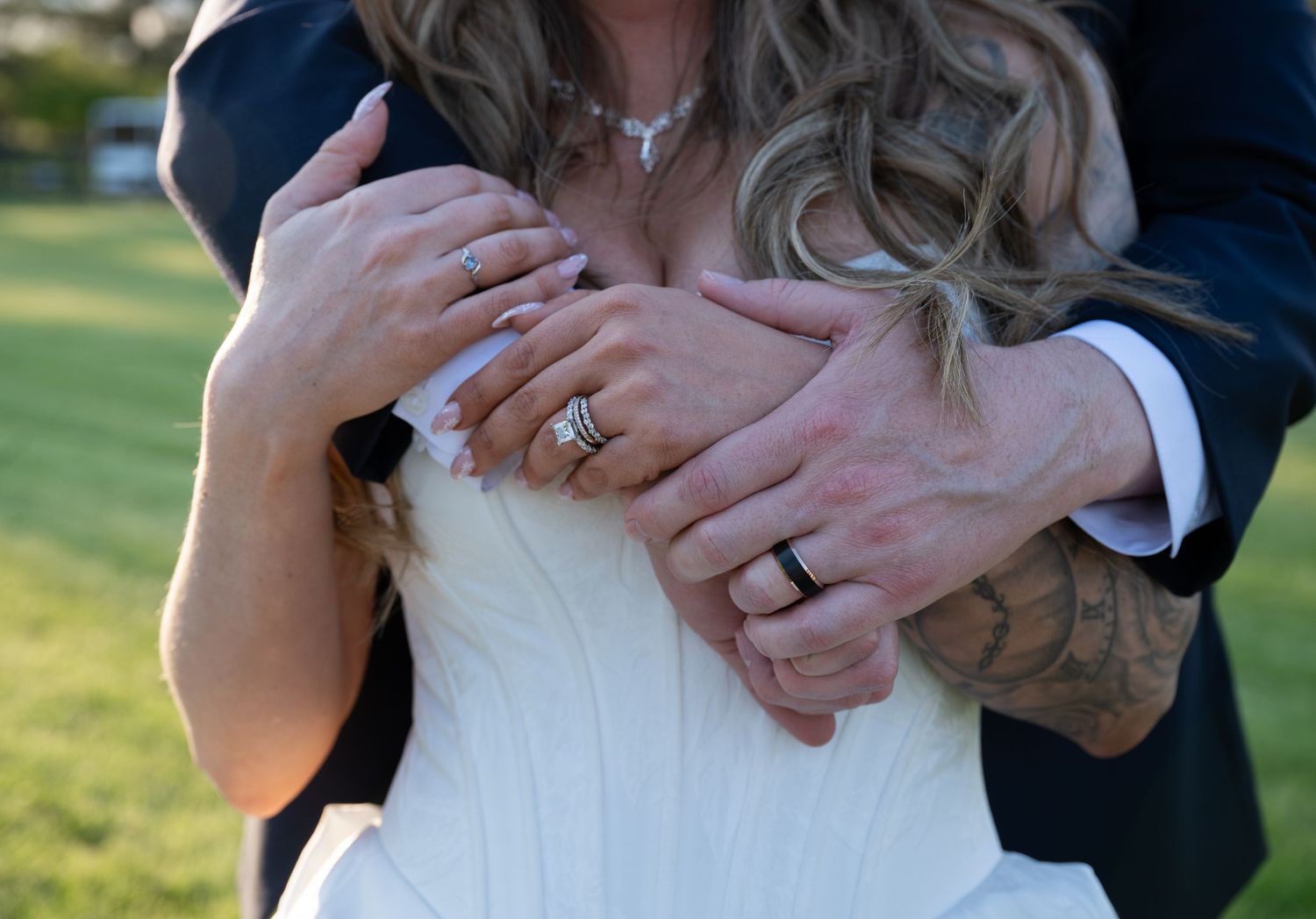 A married couple hugging.