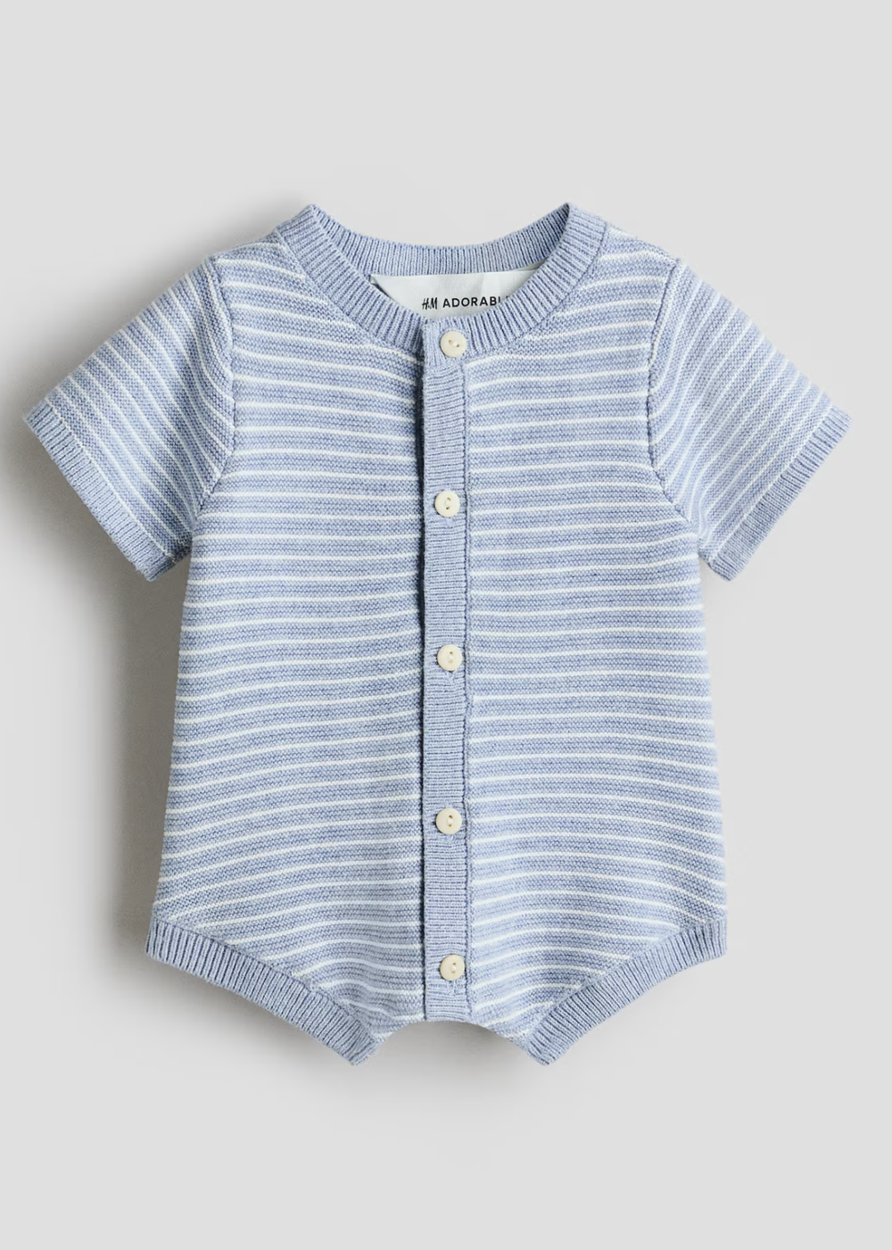 Light blue striped short-sleeve baby knit romper with white stripes and gold snap buttons down the front.