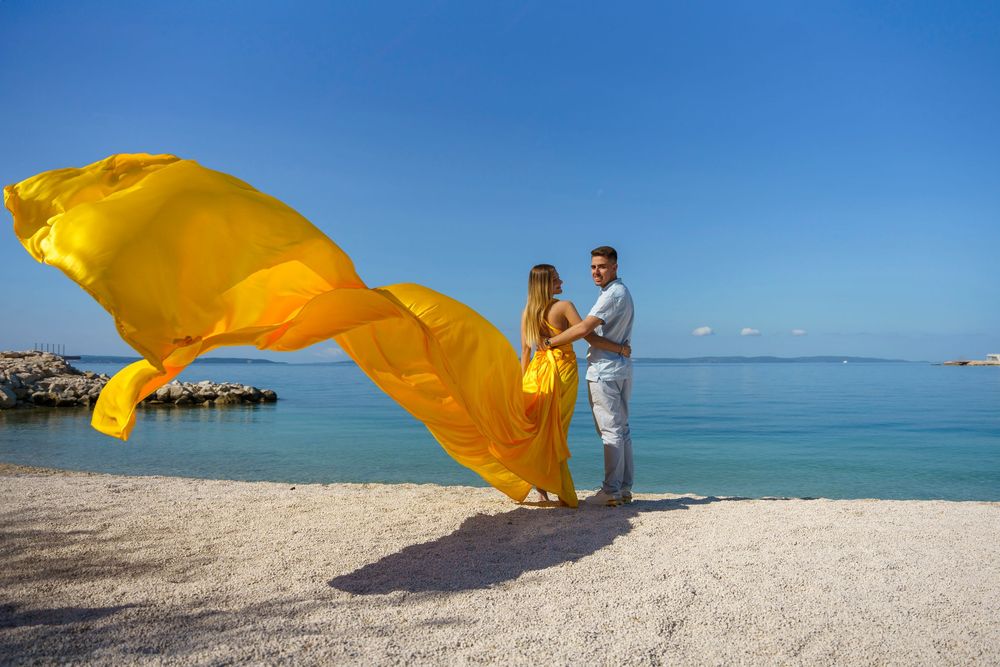 Znjan Beach Split Yellow Couple Flying dress Croatia SPLIT PHOTO AGENCY