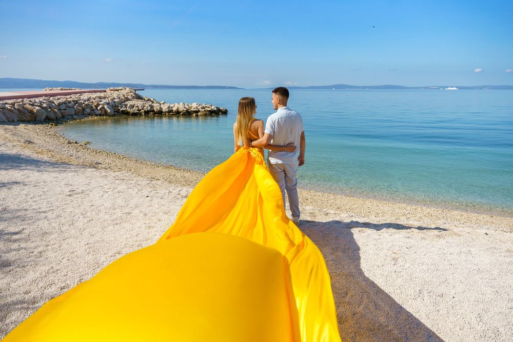 Znjan Beach Split Yellow Couple Flying dress Croatia SPLIT PHOTO AGENCY
