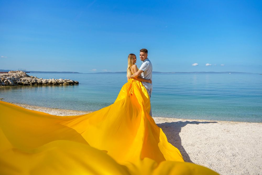 Znjan Beach Split Yellow Couple Flying dress Croatia SPLIT PHOTO AGENCY