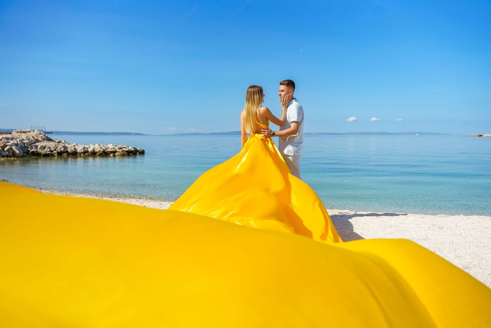 Znjan Beach Split Yellow Couple Flying dress Croatia SPLIT PHOTO AGENCY