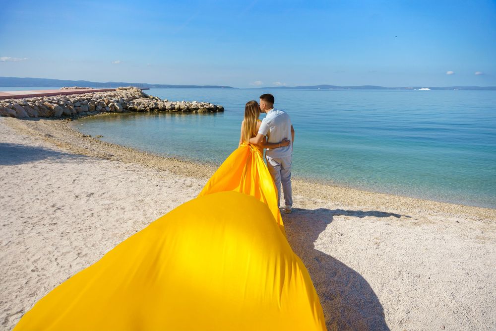 Znjan Beach Split Yellow Couple Flying dress Croatia SPLIT PHOTO AGENCY