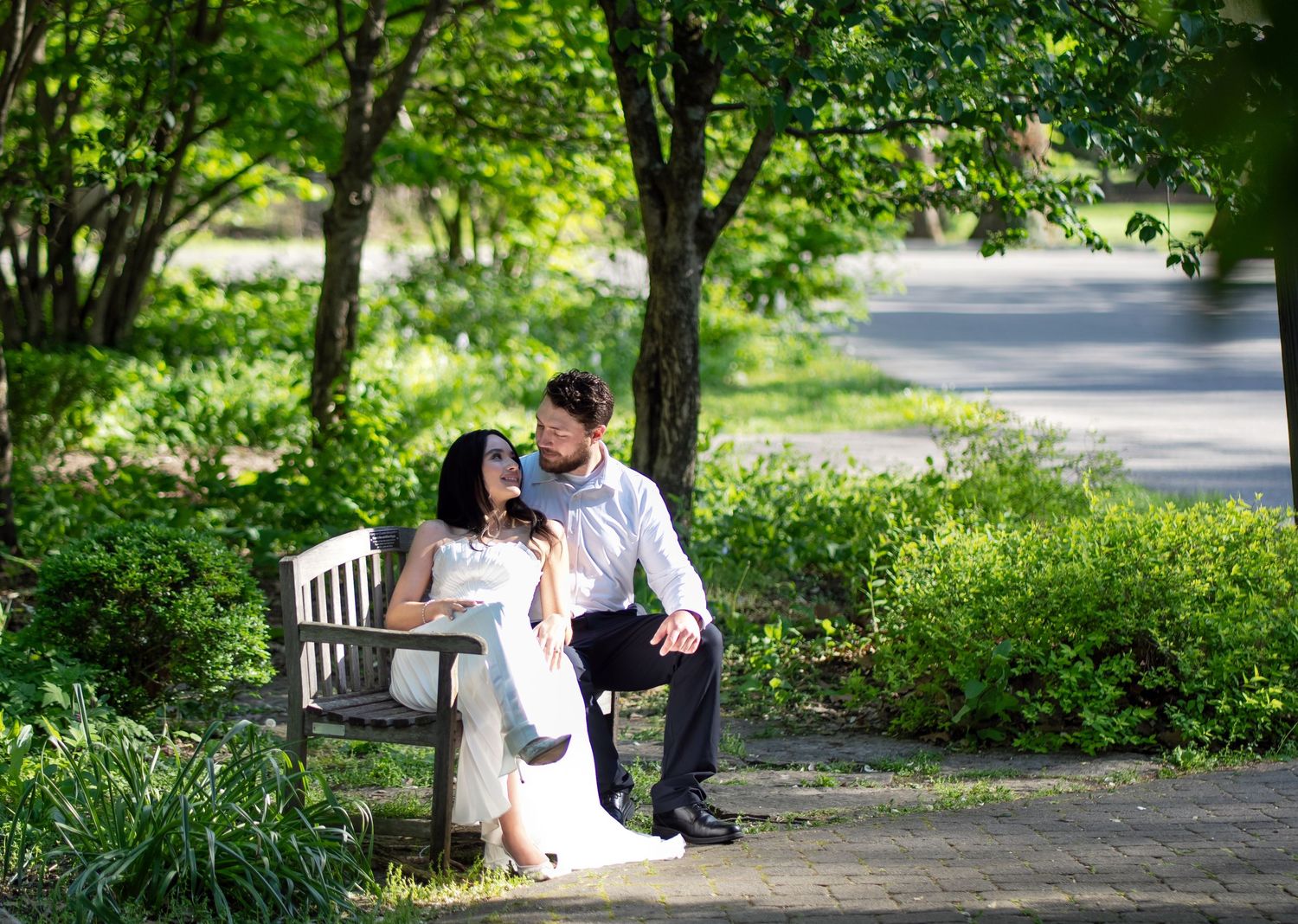 Romantic couple pose for an outdoor engagement session