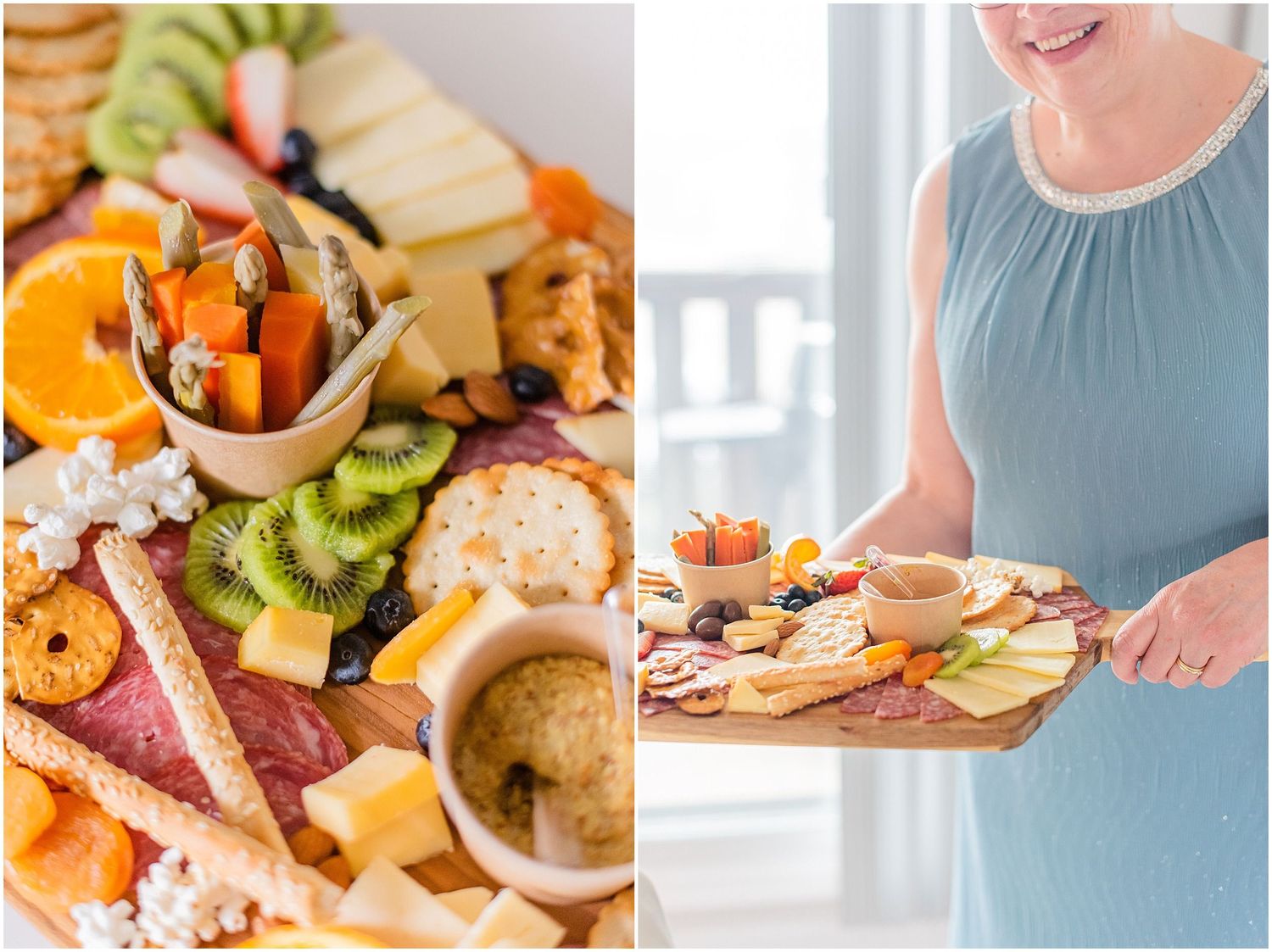A colorful charcuterie board with cheese, fruit, crackers, and meats next to a woman in blue holding a similar board.