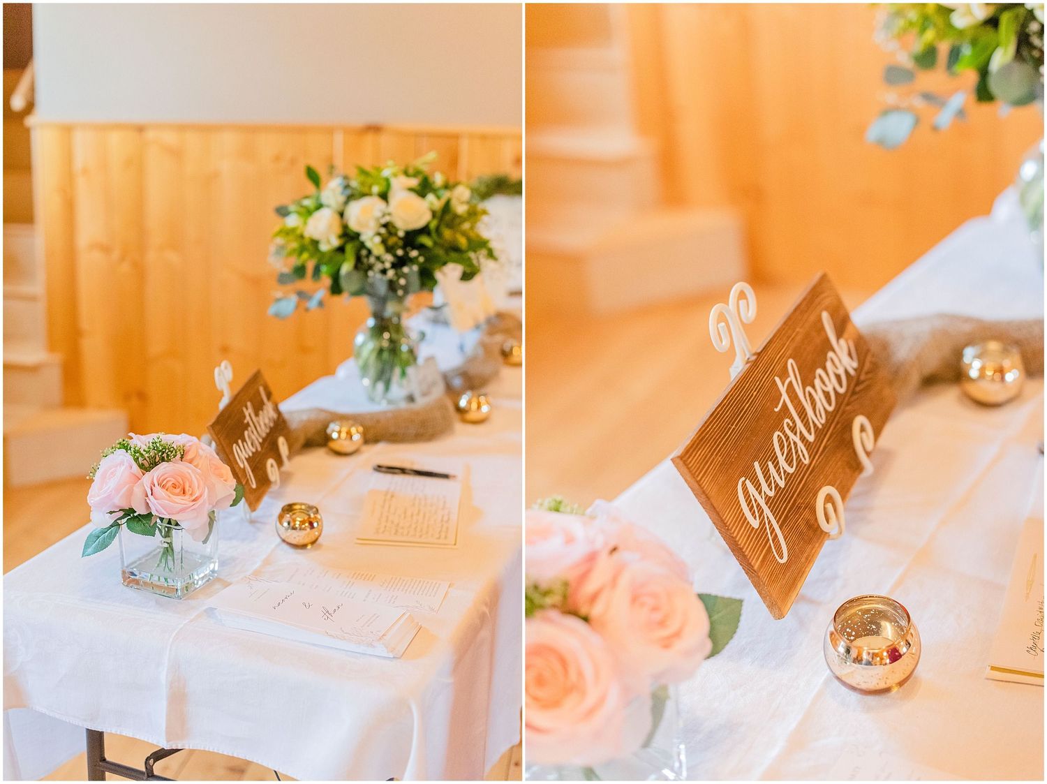 Wedding reception table with guestbook sign, pink roses, and gold candles in rustic venue.