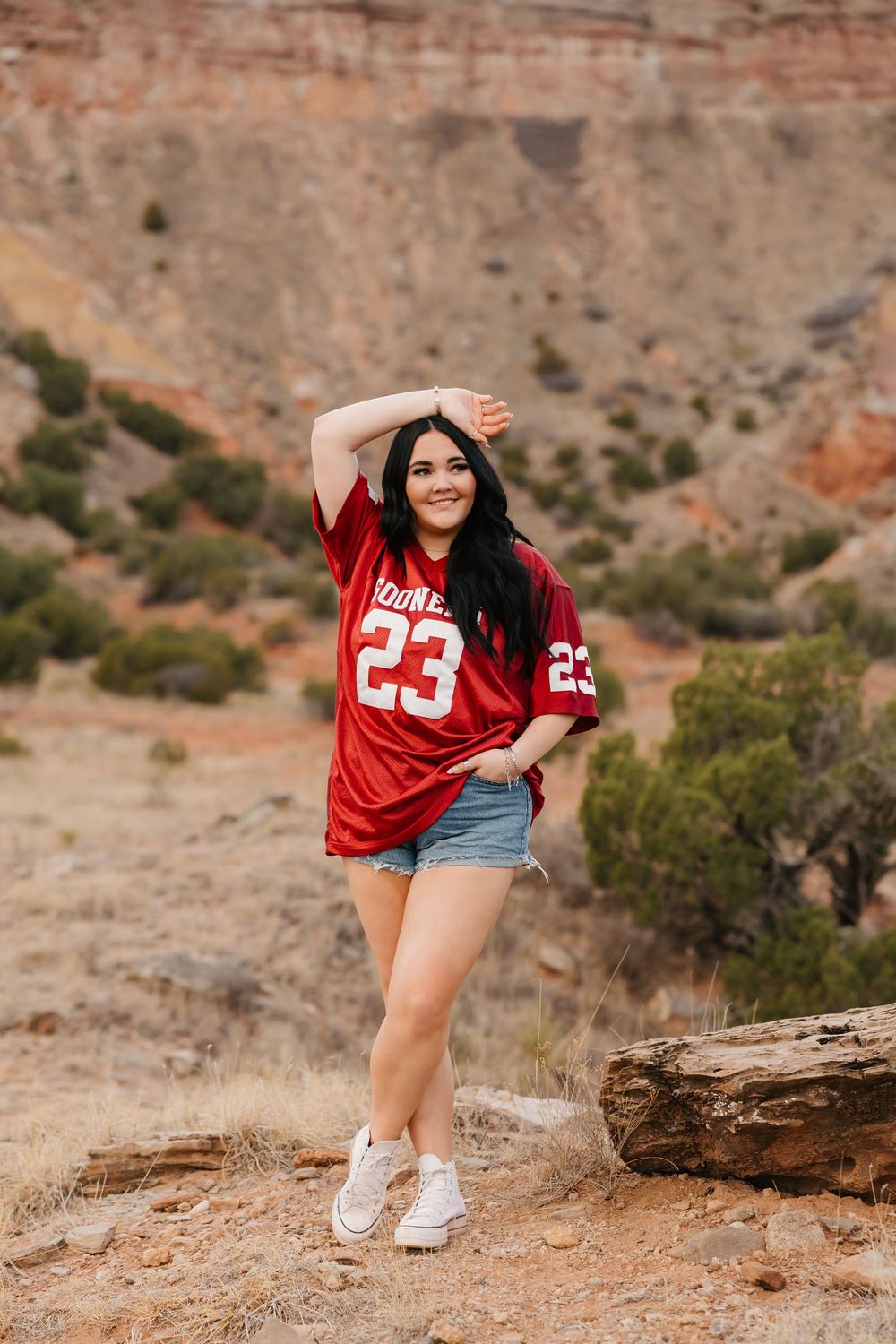 High school girl poses for senior photos in Palo Duro Canyon