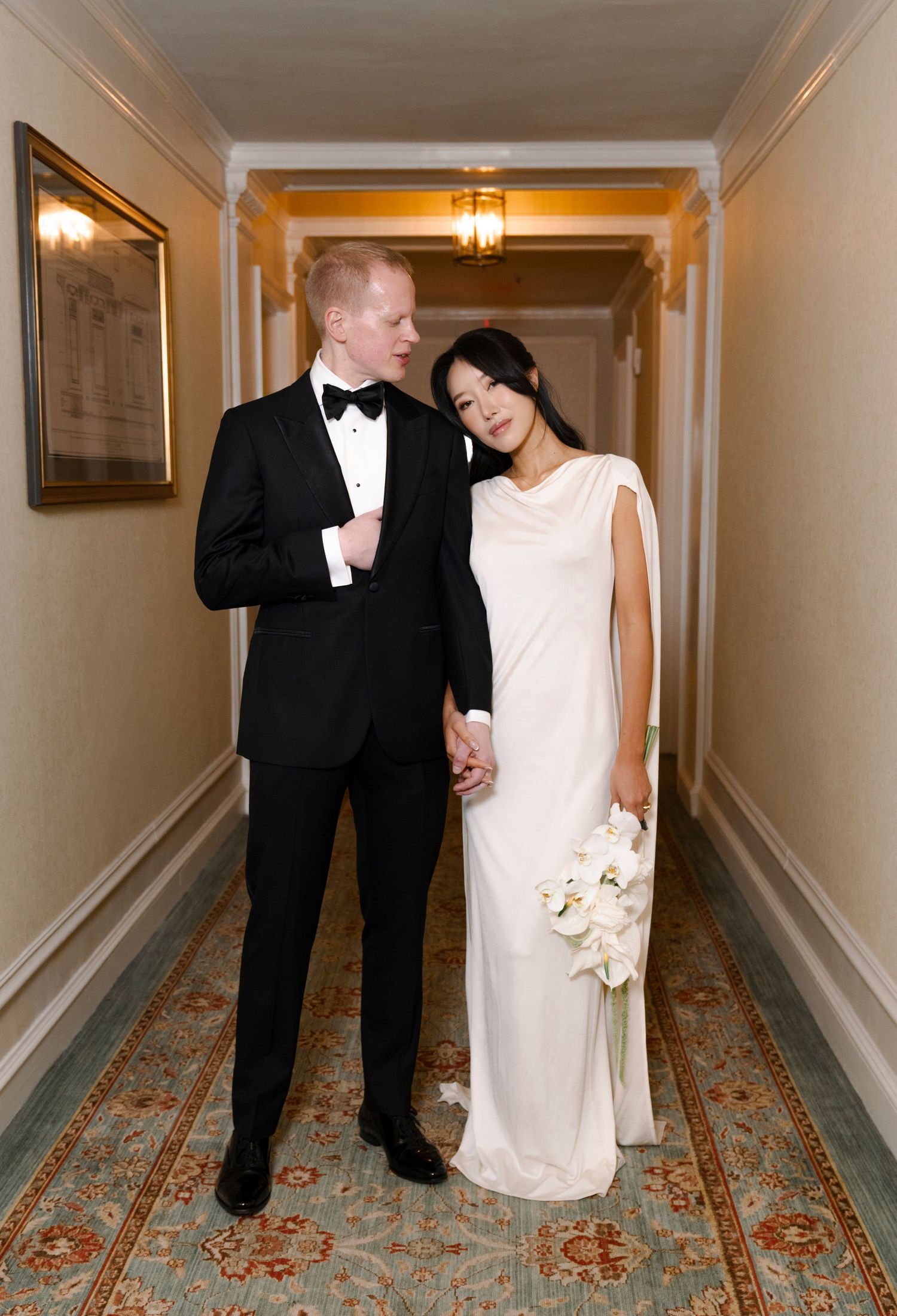 A couple in formal attire poses for a creative triptych photo series in an elegant hotel hallway.