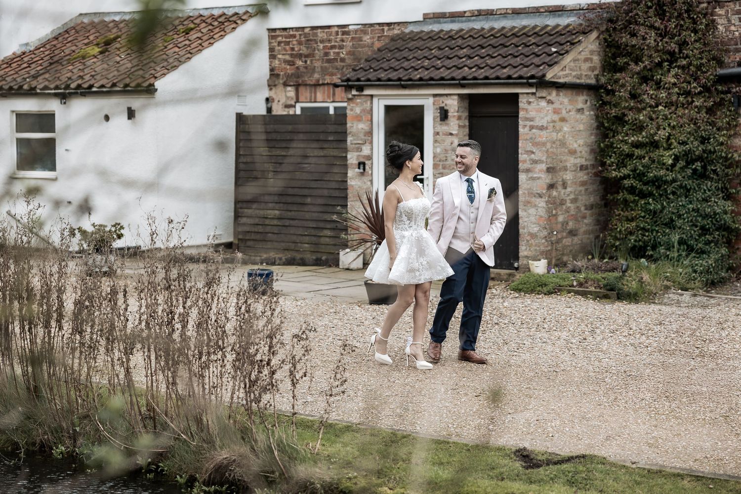 Wedding couple walking together naturally.