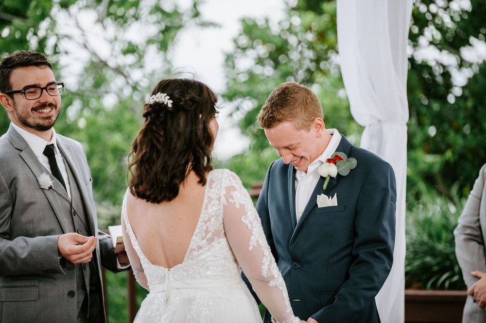 A series of candid wedding photos showing tender moments between the couple and guests during an outdoor ceremony.