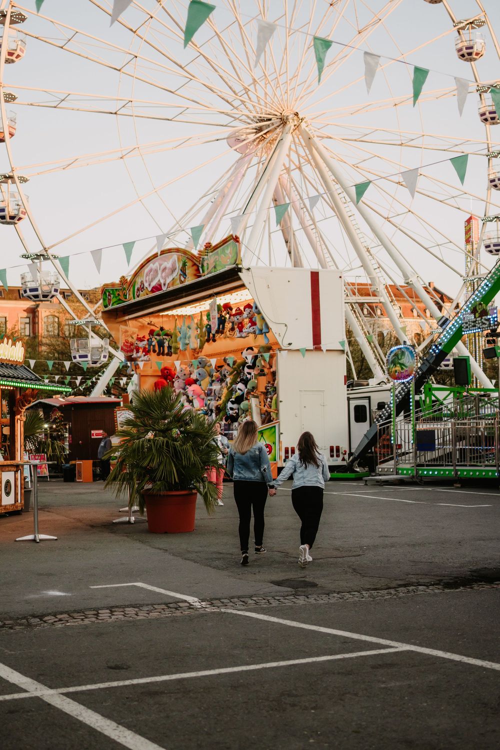 Carnival fairground with Ferris wheel and green bunting decorations visible in a panoramic view across multiple images.