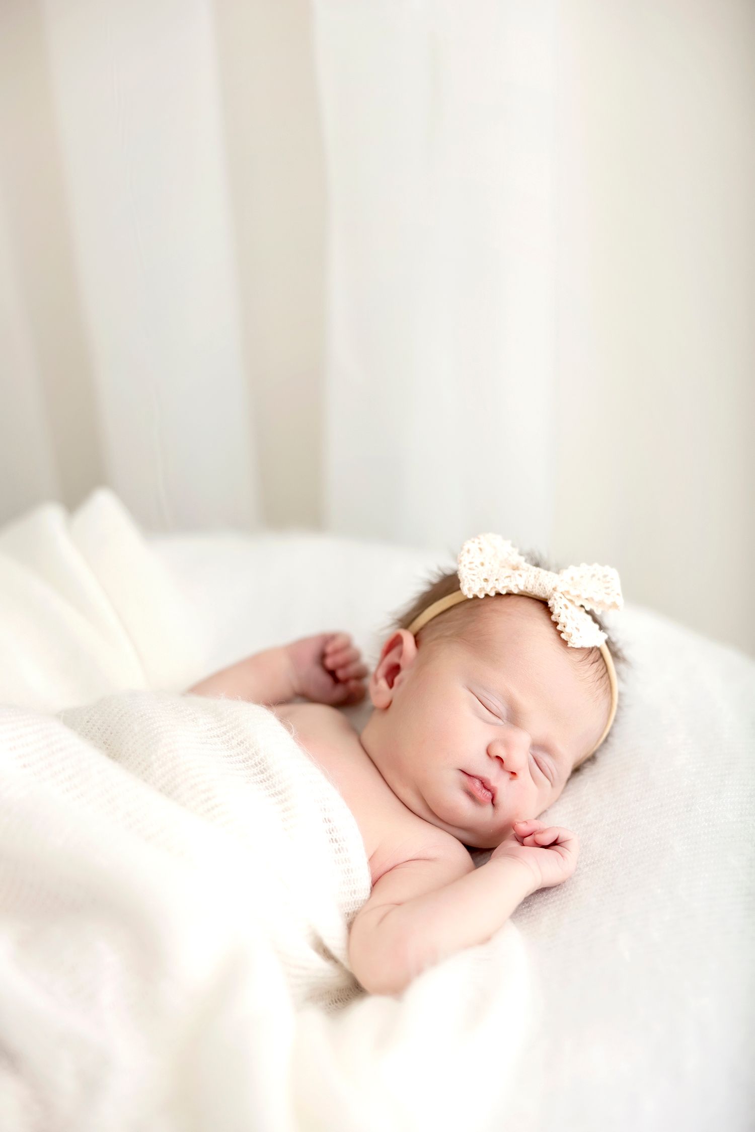 Lifestyle in home newborn photography session in Northern Iowa featuring relaxed unposed newborn
