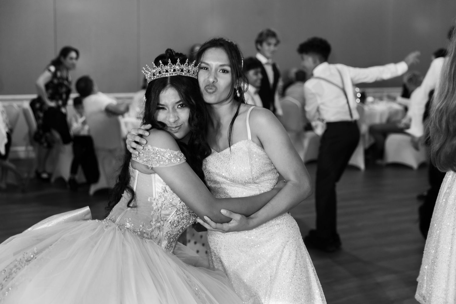 A series of black and white wedding reception photos showing couples dancing and embracing on the dance floor.