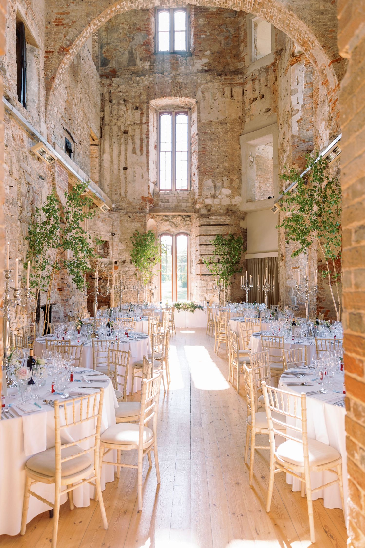 Elegant wedding reception setup at Lulworth Castle, Dorset wedding venue, photographed by Maddie Waters wedding photographer