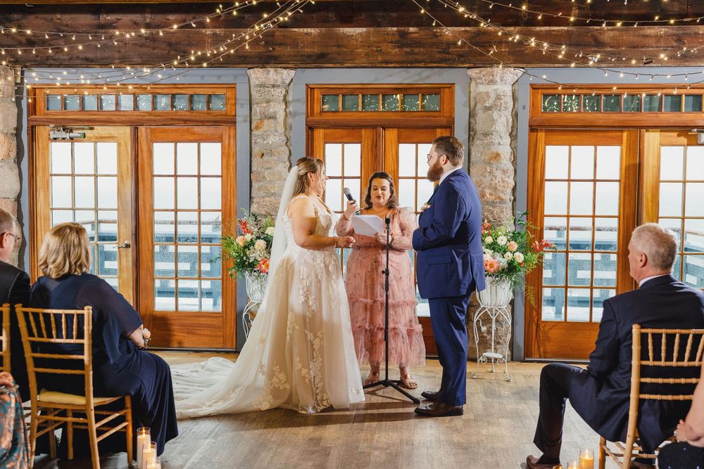 Wedding ceremony sequence showing guests and decor in rustic stone venue with string lights.
