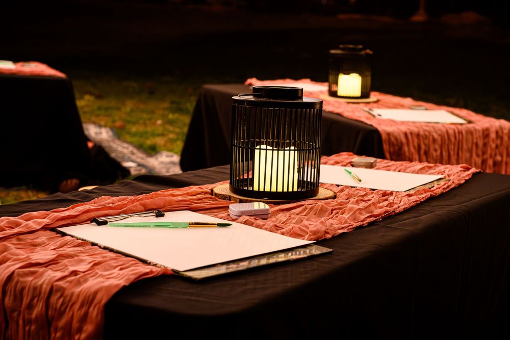 Close-up view of a mindful painting class setup with dramatic lighting. Branding photography Las Vegas. Whimsical commercial photography