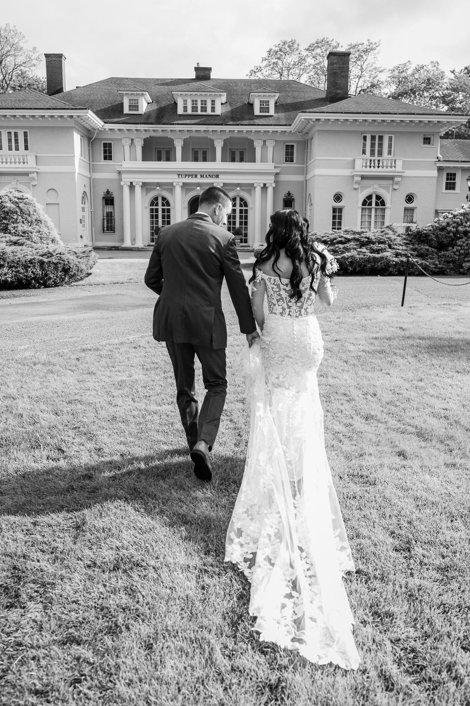 Timeless couple portrait at Tupper Manor showcasing classic North Shore estate architecture.
