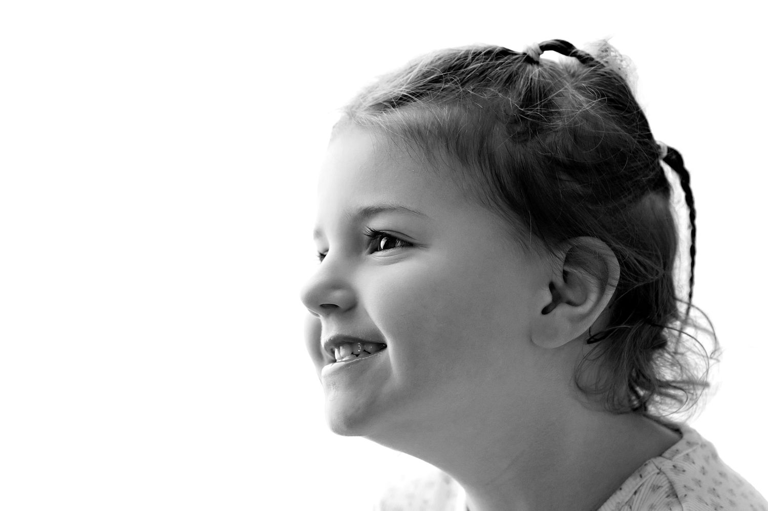 A black and white photo montage showing four profile views of a person's face looking upward.