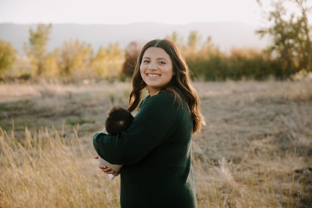 Family photo series in outdoor setting with warm autumn colors and natural poses.