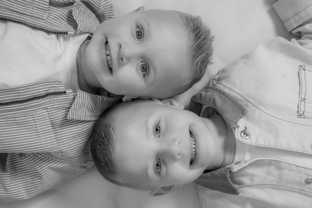 Black and white photo collage showing the same person in different poses against a light background.