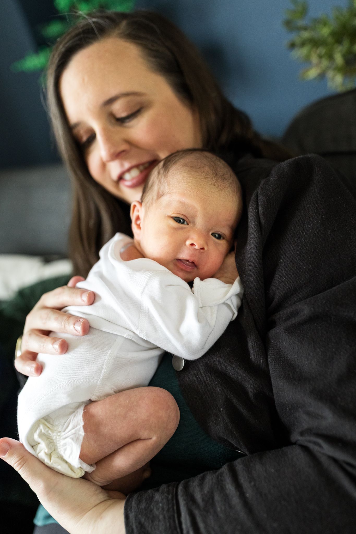 mum holding her tiny newborn baby girl