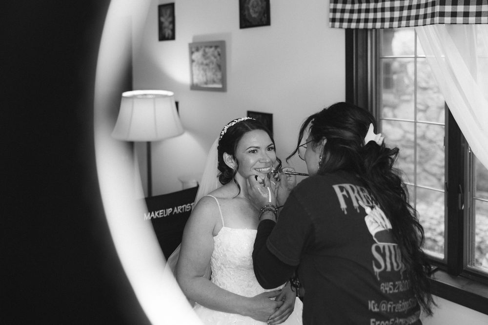 Black and white photo series showing intimate moments of a couple embracing and sharing affectionate gestures.