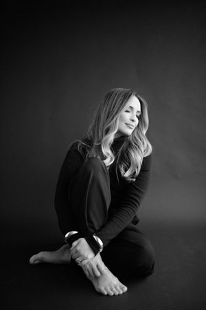 Dramatic black and white photo series showing a person in dark clothing moving through expressive poses against dark background.