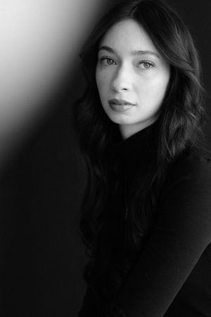 Dramatic black and white portrait series with moody lighting and dark shadows.