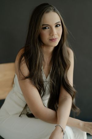 Portrait series showing a woman in white dress posing elegantly against dark studio background.