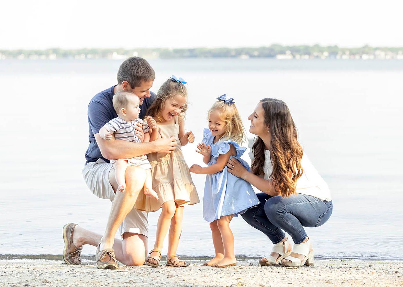 Family having fun in Clear Lake family photography session on the beach