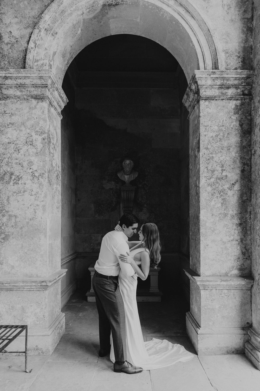 Romantic couple portrait in historic architecture photographed in Oxana's destination wedding photography style