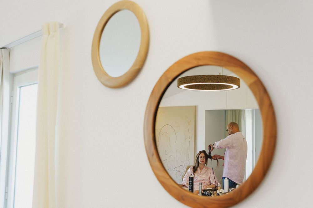 Bride having her makeup done at Craveiral Farmhouse in Alentejo