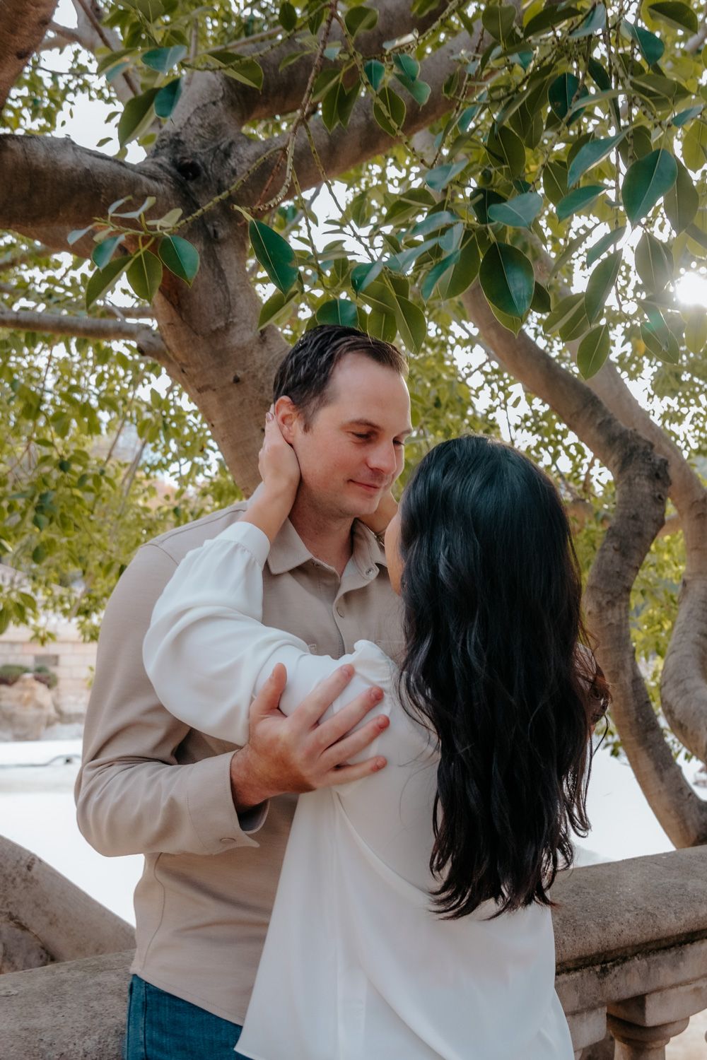 Loving embrace near greenhouse Barcelona Engagement photoshoot Barcelona BarcelonaLoversPH