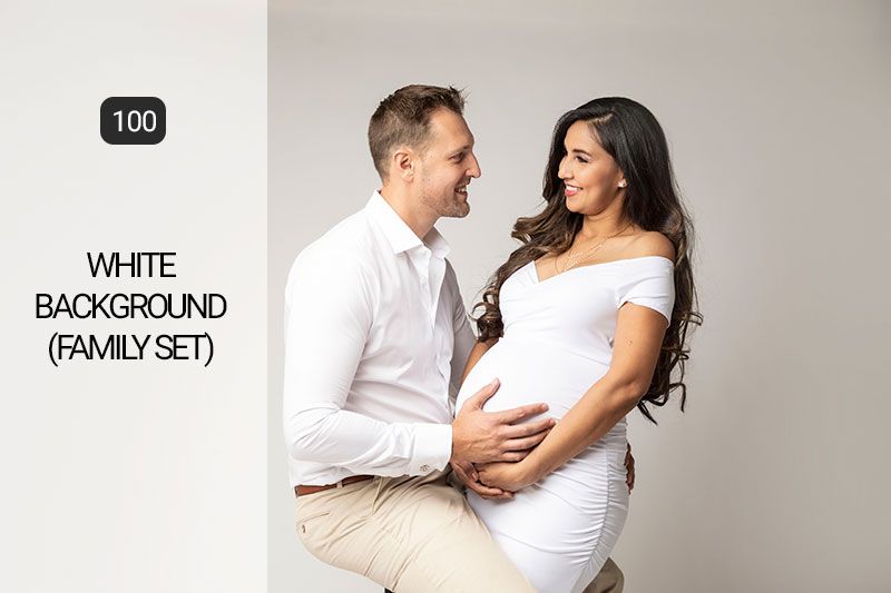 Clean white photography studio backdrop setup with professional lighting equipment.