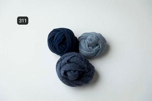 Navy and gray fabric wraps positioned artistically on white background.