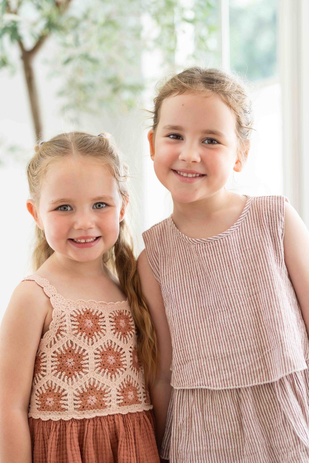 Siblings in mid-morning light during an outdoor family photography popup in Perth