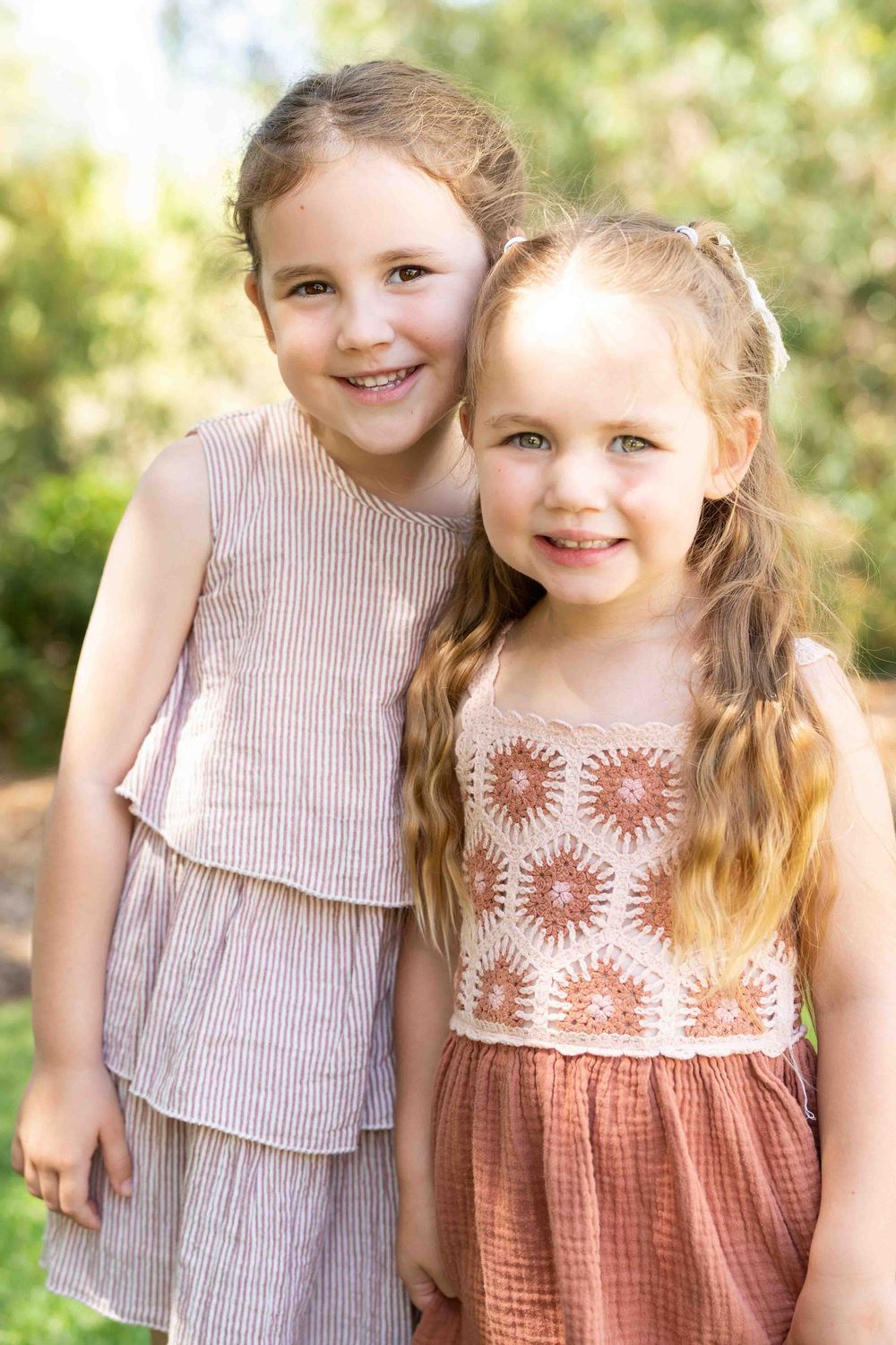 Siblings in mid-morning light during an outdoor family photography popup in Perth