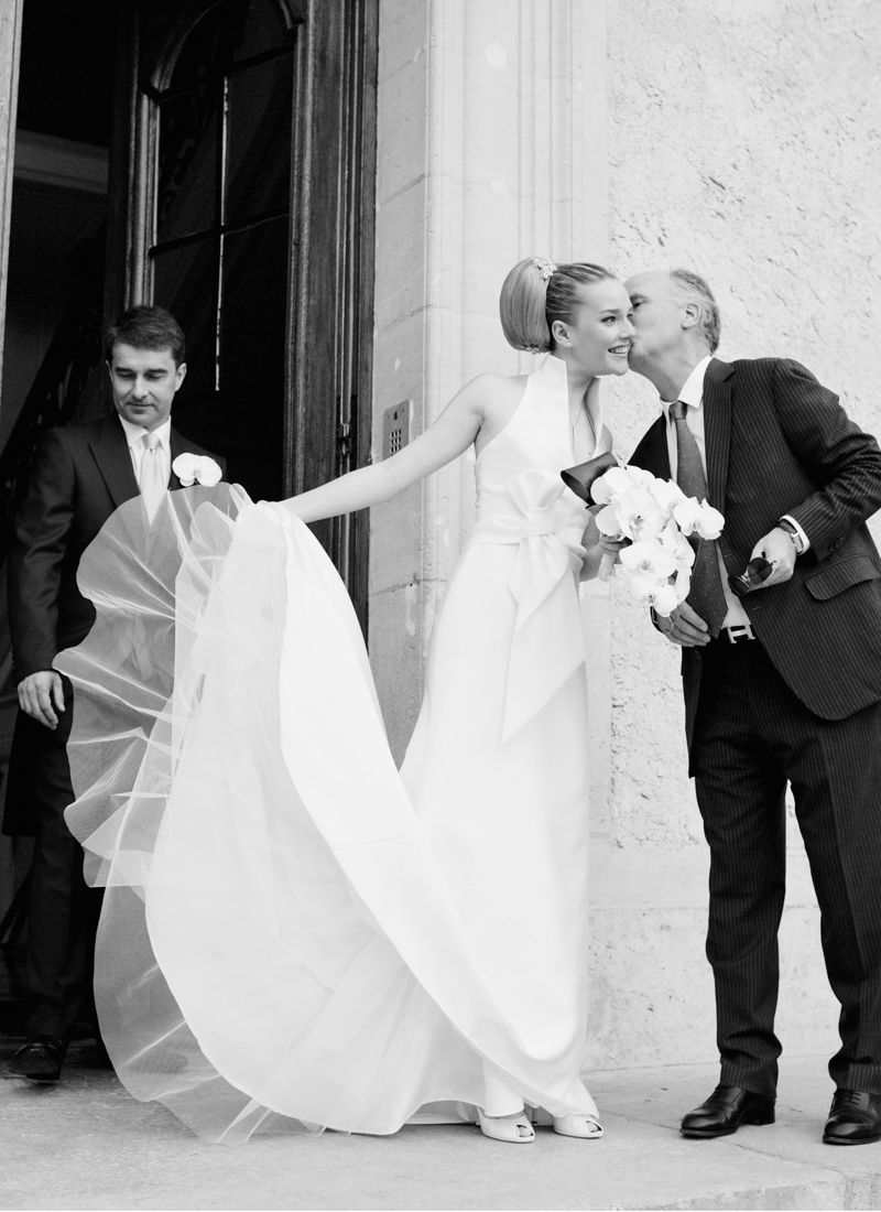 Bride and father of the bride leaving the Château de Santeny for ceremony near Paris