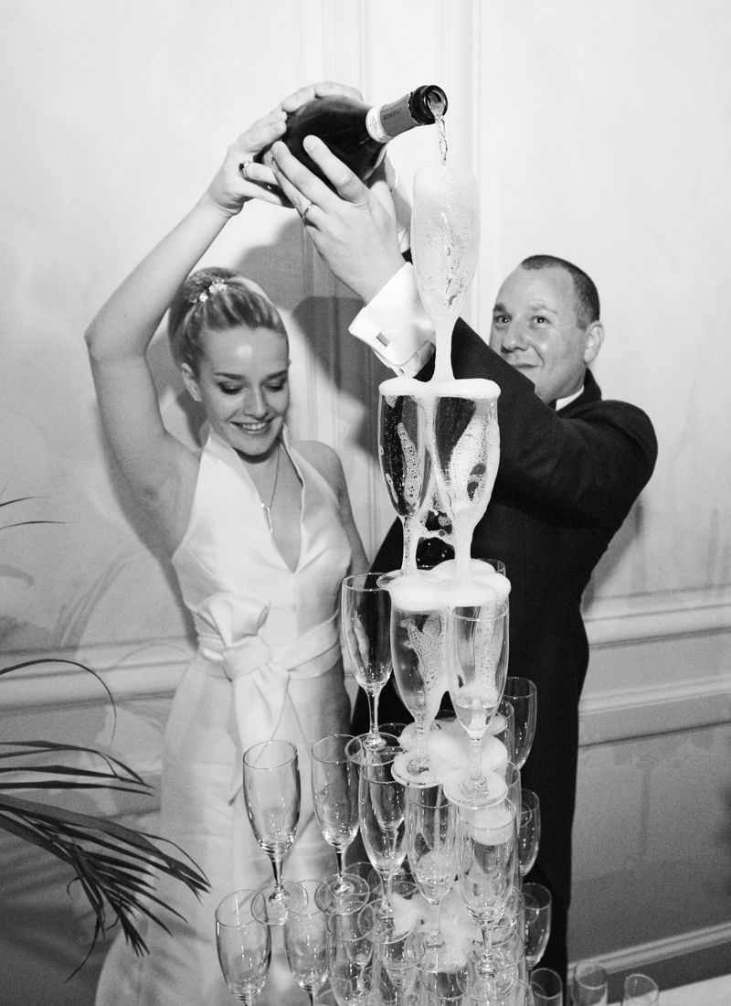 Champagne tower celebration during a Château de Santeny wedding reception