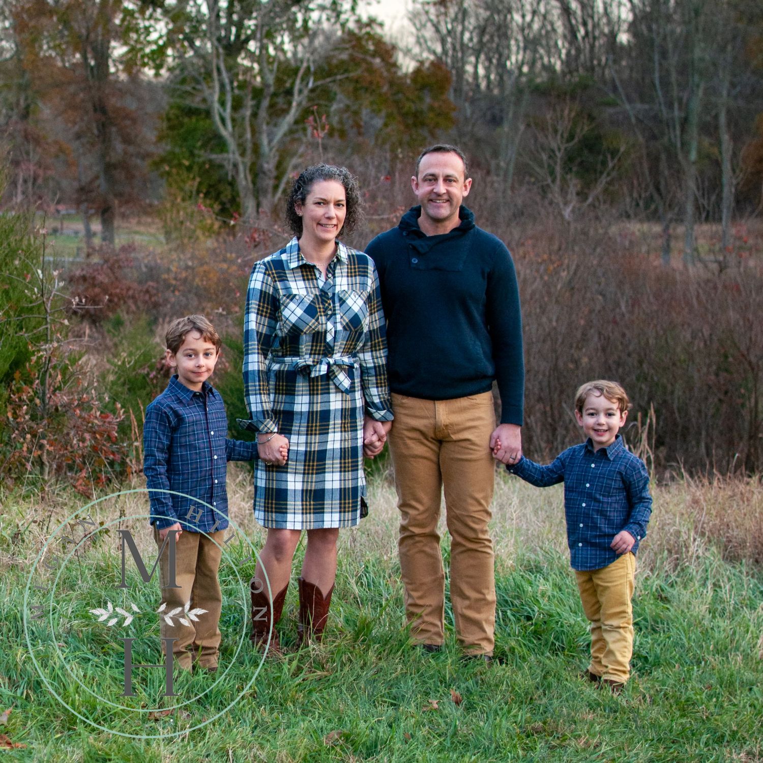 Family walking together in a field at Lake Fairfax Park