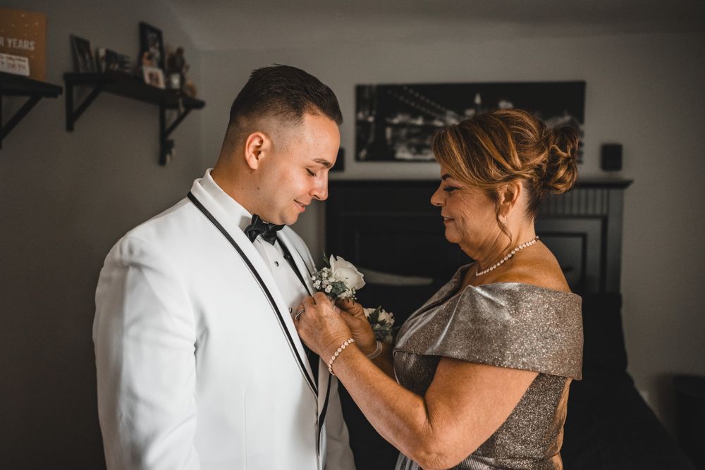 Series of black and white photos capturing moments during wedding day preparations.