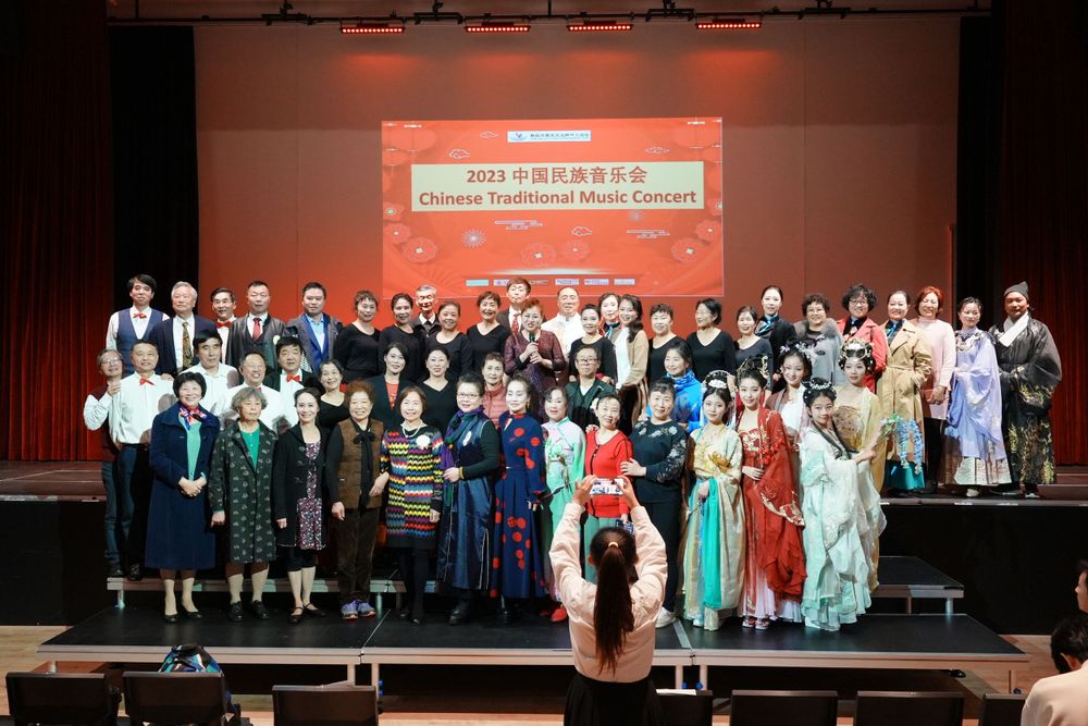 Group photo of performers in Hanfu at a Chinese Traditional Music Concert, captured by an Auckland event photographer.