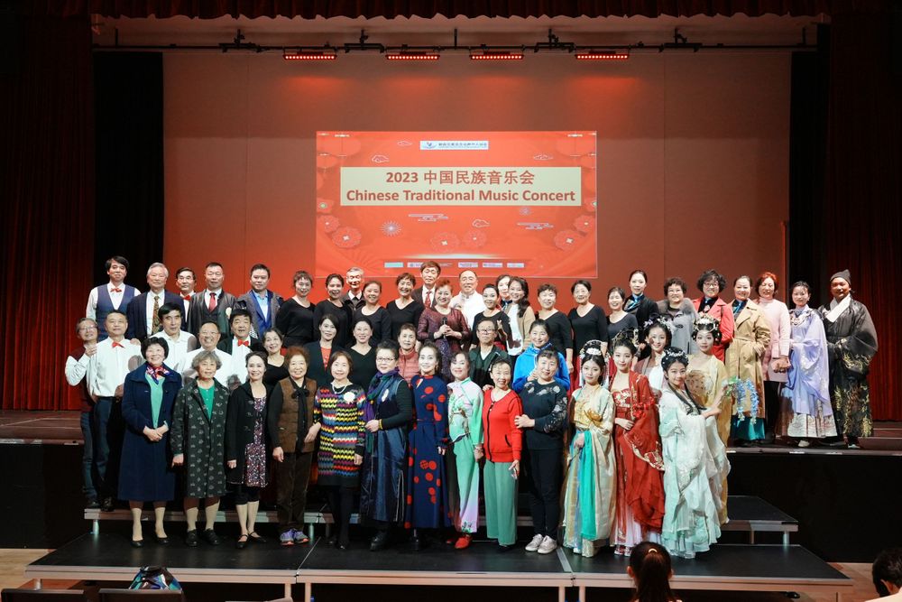 Group photo of performers in Hanfu at a Chinese Traditional Music Concert, captured by an Auckland event photographer.