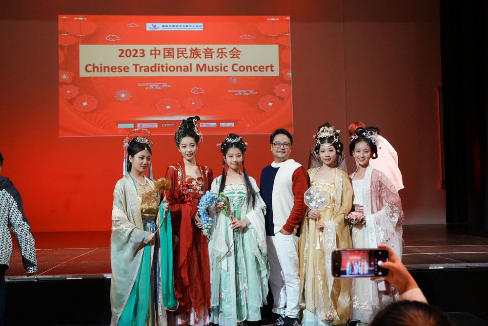 Group photo of performers in Hanfu at a Chinese Traditional Music Concert, captured by an Auckland event photographer.