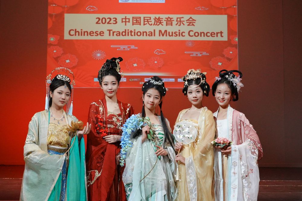 Group photo of performers in Hanfu at a Chinese Traditional Music Concert, captured by an Auckland event photographer.